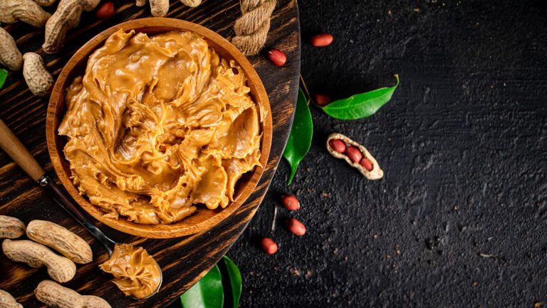 peanut-butter-on-a-wooden-tray-with-leaves-2023-11-27-04-53-21-utc.jpg